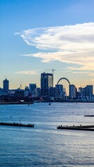 Poster - Dynamic City Skyline Featuring Temporary Structures and Cranes