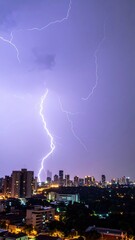 Poster - Dramatic Skyline with Lightning Strike Illuminating the Cityscape