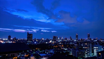 Poster - Urban Cityscape at Blue Hour with Dramatic Sky and Lights