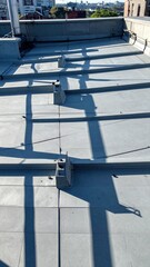 Poster - Intricate Shadows on a Rooftop Surface with Patterns and Designs