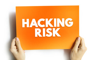 Fototapete - Hacking Risk - act of gaining unauthorized access to data in a system or computer, text concept on card