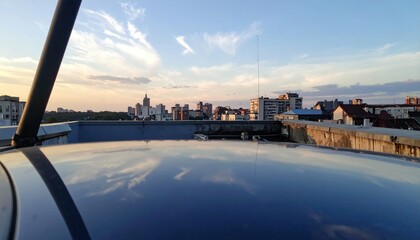 Poster - Reflections on Vehicle Rooftop with Cityscape Views at Sunset