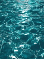 Wall Mural - Crystal Clear Blue Water Texture with Reflections and Light Patterns for Soothing and Peaceful Background Design