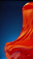 Poster - Flowing Orange Fabric Against Blue Backdrop: Abstract Motion and Color Study