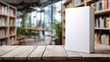 © Shahriar - A blank book standing upright on a wooden table with a blurred bookshelf background, ideal for cover design presentations and marketing. mockup .