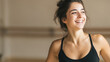 © Postmodern Studio - Joyful young woman exercising in studio setting for fitness and wellbeing