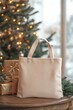© Namdang - Minimalist Tote Bag Displayed Near Christmas Tree and Gifts