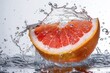 © legitStock - Orange Slice Splashing with Water Droplets in Motion