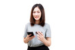© Minttita - Asian young beautiful woman holding a smartphone and a credit card, appearing to make an online transaction.