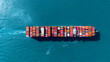 © boygek - Top view Cargo Container ship with contrail in the ocean ship carrying container and running for import export concept technology freight shipping by ship.