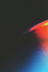 Wall Mural - abstract gradient texture with vibrant red and blue light on dark background