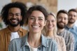 © whitestorm - A diverse and enthusiastic group of professional colleagues is smiling together, showcasing a positive and collaborative work environment and inclusive corporate culture.