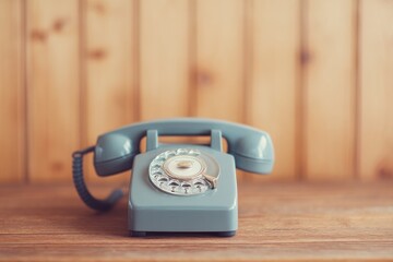 Poster - vintage telephone sits elegantly on wooden table in retro-styled room