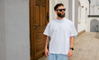 © San4ezz007 - White T-shirt on a bearded hipster in sunglasses — urban mockup for brands