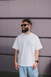 © San4ezz007 - White T-shirt on a bearded hipster in sunglasses — urban mockup for brands