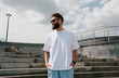 © San4ezz007 - White T-shirt on a bearded hipster in sunglasses — urban mockup for brands
