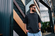 © San4ezz007 - Bearded hipster in black t-shirt and sunglasses — urban mockup for brands
