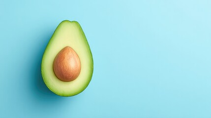 Poster - minimalistic top-down shot of single ripe avocado finely sliced lay on spacious clean solid color backdrop with ample