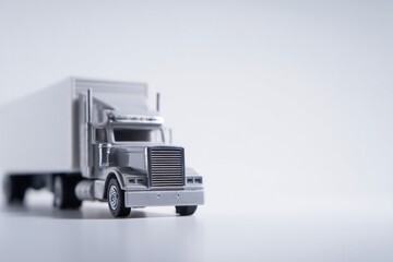 Poster - close-up of minimalist model truck placed on white background with adequate copy space