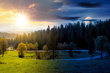 day and night time change concept. road winding through forest in mountain landscape. nature scenery