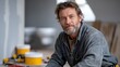 © Anna - man with a beard operates various tools on a construction site. Surrounded by building materials, he demonstrates expertise in carpentry during a home renovation project