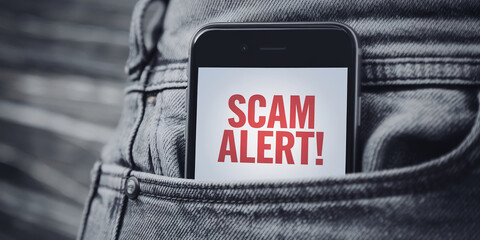 Poster - Smartphone in a jeans pocket displays a scam alert, warning against fraudulent activities, symbolizing online security and safety