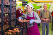 © JackF - Woman and man loading harvested peaches