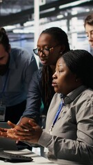 Poster - Vertical video Angry technicians in server room fighting each other after encountering critical error popup during maintenance. Engineers having tense conversation, doing system recovery brainstorming