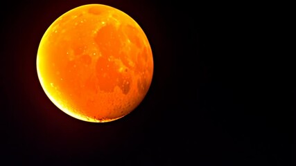 Wall Mural - Isolated full moon in the dark night sky, glowing celestial body with a vibrant orange and black surface, cosmic, lunar phase, astronomical, space scene