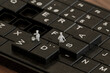 © Westend61 - Miniature chefs working on a 3D keyboard in a creative digital art scene
