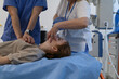 © Halfpoint - Doctors performing CPR on teenage patient in critical condition