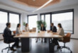 © Adi - having a meeting in a blurry office, the atmosphere of a group of people having a meeting in a natural-themed, modern office with a wooden table, with a blurry office background