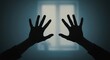 © mhmdyatt - Hands Reaching Toward Window in Dark Silhouette