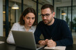 © YourPSguy - Business Team Collaborating on Laptop in Modern Office