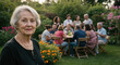 © Vasiliy - Senior woman in black dress with pearl necklace at family gathering in garden