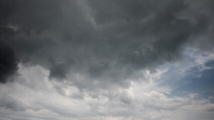 Wall Mural - dark sky with stormy clouds. dramatic sky rain,dark clouds before a thunder-storm,clouds before rain