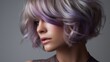 © Antonio  - Grey Choppy Bob with Purple Chunky Highlights for woman.