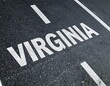 © Simon - Virginia text on asphalt road marking, white lines on black pavement