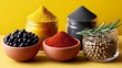 © Nataliia_Trushchenko - Variety of spices are displayed in bowls on a yellow background. The spices include black pepper, red pepper, and yellow pepper. The bowls are arranged in a row
