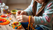 © Timothy - girl making colorful bead bracelets