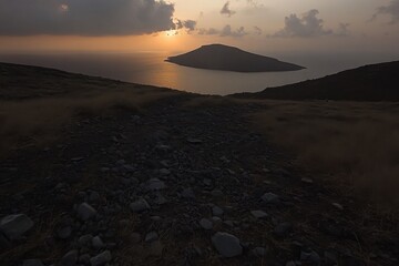 Wall Mural - Dramatic Island Sunset View from Rocky Hillside in Santorini Greece Low Angle Scenic Landscape