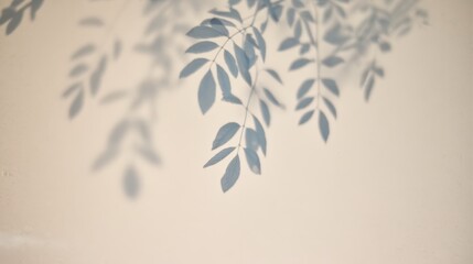 Poster - Delicate shadow of leafy branches cast on a light beige wall, creating a calm and minimalistic natural pattern.