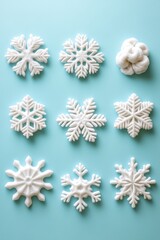 Poster - Winter Snowflakes Flat Lay on Light Blue Background Overhead View Holiday Season Decoration