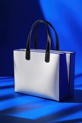 Poster - White and Blue Tote Bag Still Life Product Shot on a Blue Background with Shadows Studio Lighting