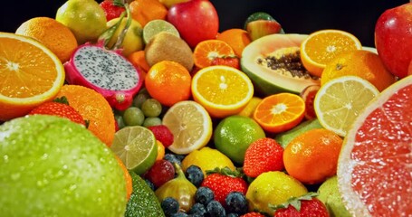 Aufkleber - Various Kind of Fresh Exotic Fruits. Camera Placed on Motion Control System. Filmed on High Speed Cinema Camera. Camera in Motion. Isolated on Black Background.
