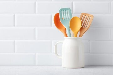Poster - minimalistic image of clean kitchen countertop featuring cleverly organized array of colorful utensils to showcase