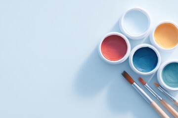 Poster - minimalistic arrangement of art tools and paints on clean white canvas with ample copy space