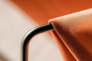 Poster - Fabric draped over modern metal chair highlighting texture and design elements in a contemporary interior setting