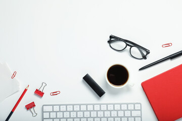 Poster - Flat lay composition with stationery and coffee on white background. Space for text