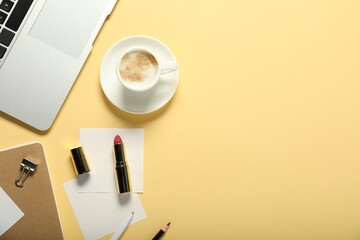 Poster - Flat lay composition with stationery and coffee on beige background. Space for text
